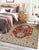 Talia Traditional Coral Hand Knotted Wool Rug, Country of Origin: India. This exceptional piece showcases the enduring...