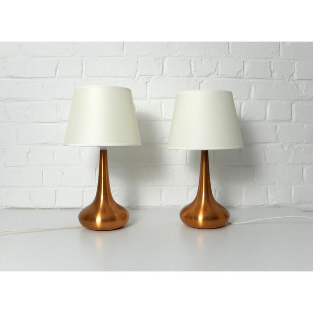 Pair of Orient table lamps in brushed copper. Design by Jo Hammerborg in 1957 for Fog & Morup, Denmark. Jo Hammerborg has...