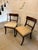 A very elegant pair of antique English mahogany dining side chairs dating from the Regency period, early 19th century. The...