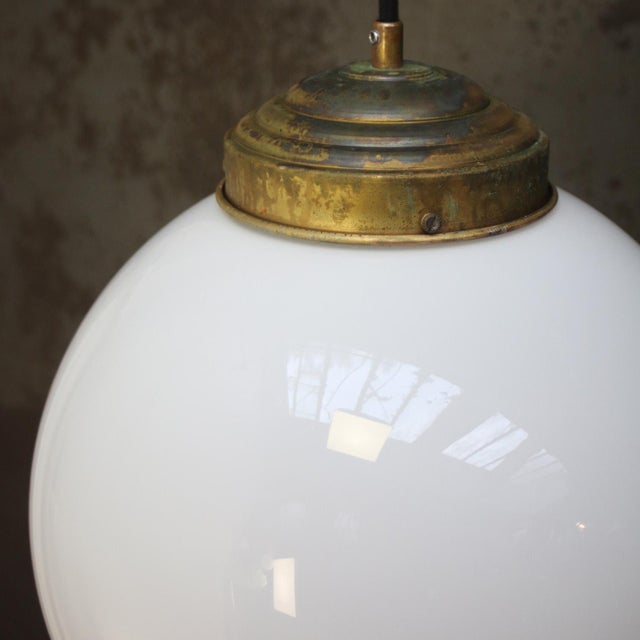 Opaline glass globe with Brass 2 meter black cotton flex Brass top E27 / E26 Up to 250V (Europe/UK Standard).The wiring of...