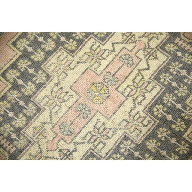 Introducing a one-of-a-kind vintage Turkish hand-knotted wool rug, carefully crafted by skilled artisans using traditional...
