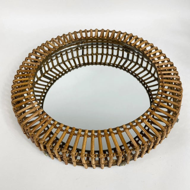 Rare vintage round rattan mirror byMatt Carr for Umbra. Made in the late 20th century.
