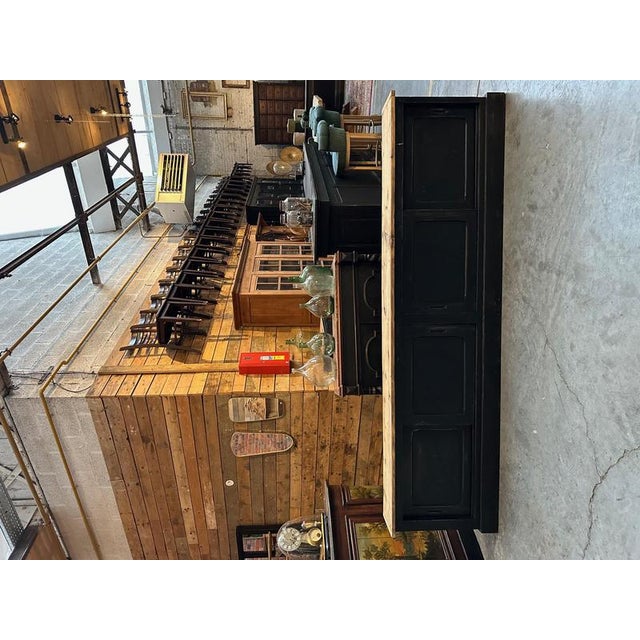 This piece of furniture has been completely restored. It has four large, fully functional sliding doors that open onto...