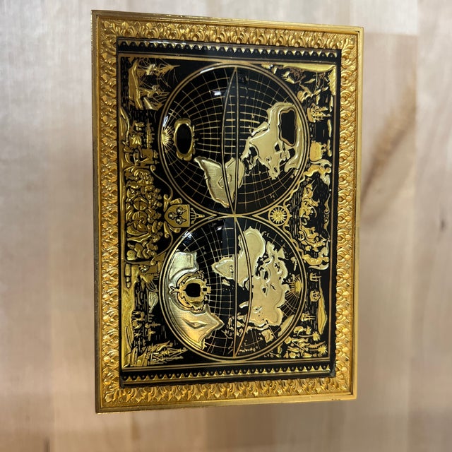 A transparent crystal regulator style case with ornate pillars reminiscent of German antique. It constructed with brass...