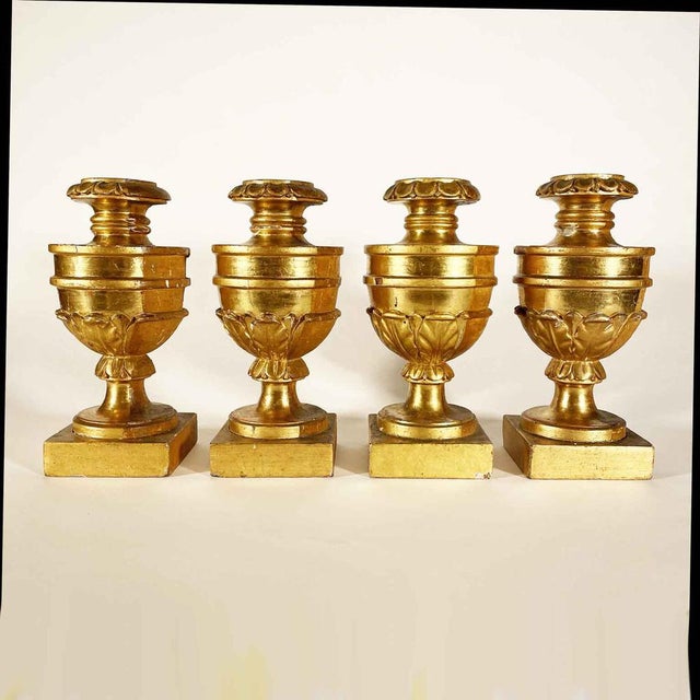 Gilded Empire Lamp Bases, 1700. Set of four palm-holder vases with a square base and turned and carved body in Swiss pine...