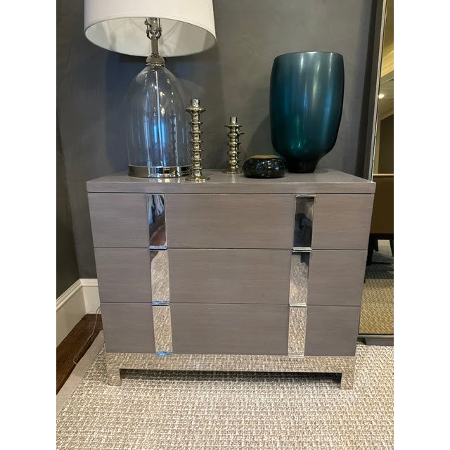 Three-drawer custom-built chest. Solid oak construction, grey finish, shiny metal detail along facing and base. Excellent...
