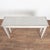 Early 20th century Swedish Gustavian style console table, crafted in pine. The table stands on tapered fluted legs topped...