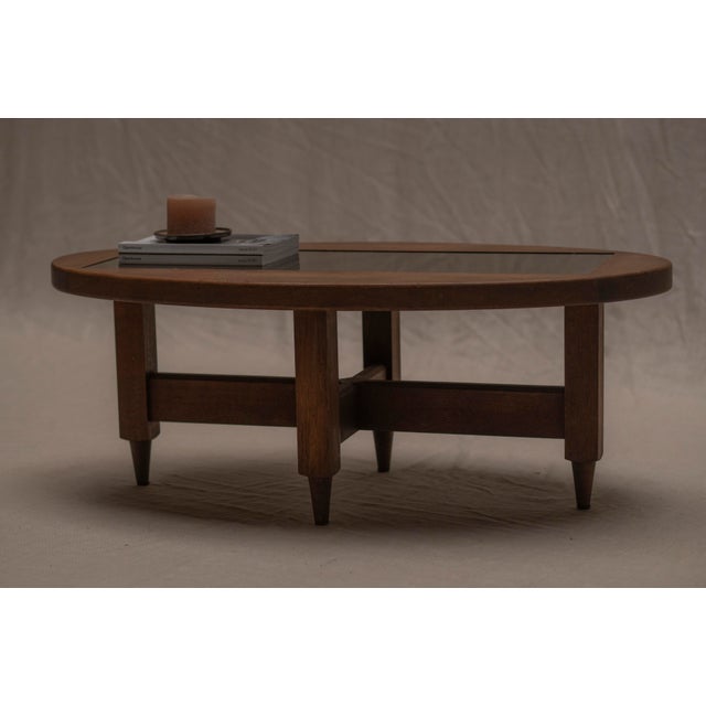 A striking mid-century coffee table by Guillerme et Chambron, part of the renowned Votre Maison series. Crafted from solid...