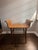Vintage Mid-Century Modern wooden bench featuring a gracefully curved backrest and solid wood seat that functions as both...