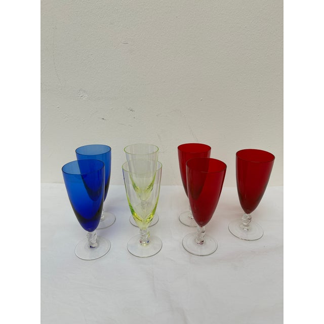 This exquisite set features seven vintage multi-color crystal goblets crafted by the prestigious French manufacturer...