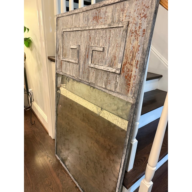 Tin-framed trumeau-style mirror with Greek key detail. Limewashed patina makes this an interesting piece for an entry way...