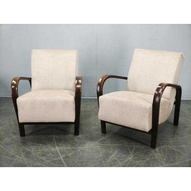 An outstanding and documented pair of lounge chairs designed by Kropáček & Kozelka for Interiér Praha, Czechoslovakia,...