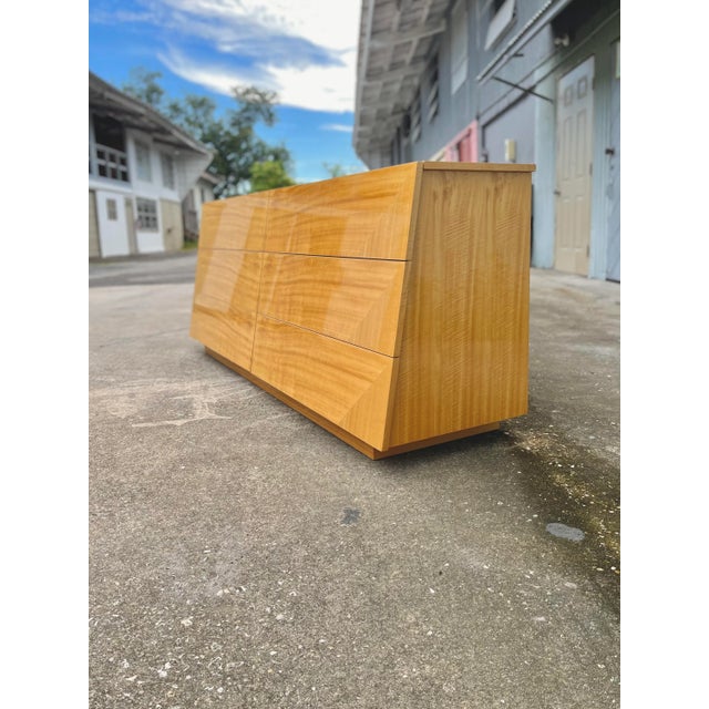 Italian mid-century modern lowboy dresser with oblique tapered façade. Giorgio Collection, Italy. Six large drawers with...
