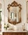 Make a dramatic statement with this ornate Baroque-inspired wall mirror, featuring an intricately sculpted frame finished...