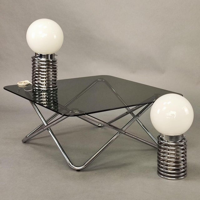 Pair of vintage 1960s Space Age spring lamps. Springy spiral base in chromed steel tubing and white glass bowl. Design...