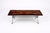 A striking and highly individual mid century modern coffee table, featuring a bold hand-painted flame motif set against a...