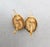 1980s goldtone oval domed with checkerboard pattern on a wire drop pierced earrings. Marked "©MONET" on the backs near the...