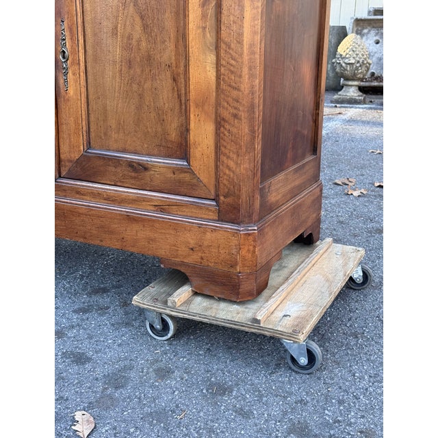 This 19th-century Louis Philippe French server exudes timeless elegance with its ornate craftsmanship and rich walnut...