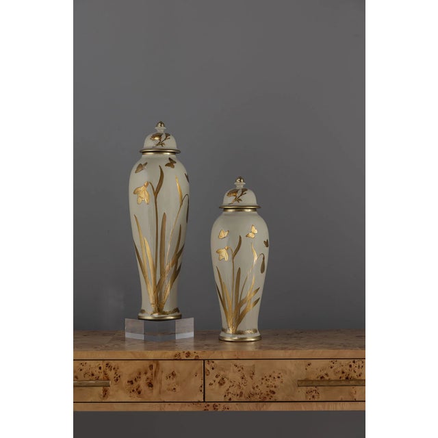 Gilded iris is a hand painted and lacquer collection of jars and lighting that depicts a walk in the garden at spring....