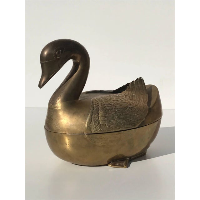 Patinated brass garden decor duck motif planter.