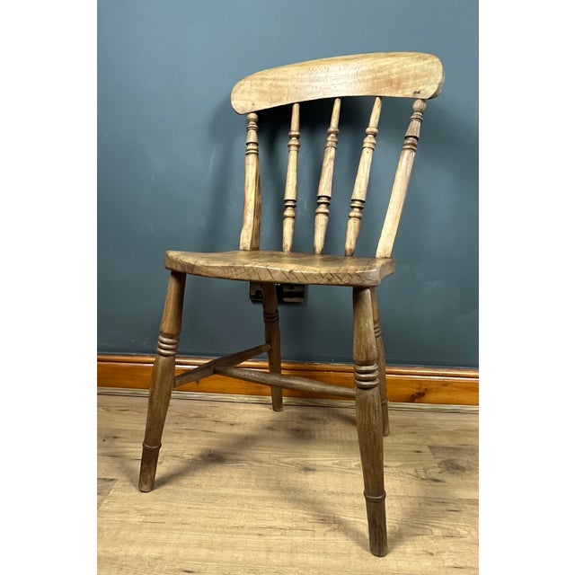 Victorian Windsor stickback kitchen chair. This style is a type of Windsor chair, a design that originated in England in...