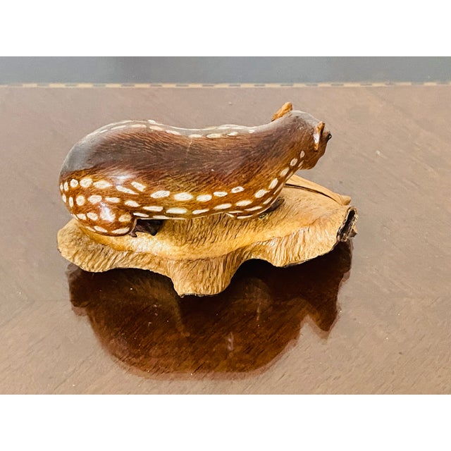 Organic modern handcarved wood naturalistic figurine of a badger.signed by the artist.