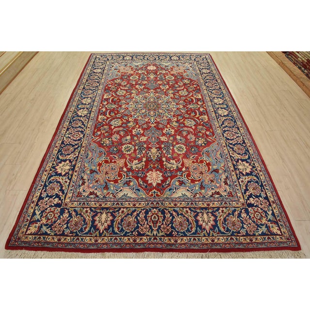 An authentic vintage traditional Najafabad rug hand-knotted with fine wool and natural dyes. This oriental rug features a...
