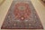 An authentic vintage traditional Najafabad rug hand-knotted with fine wool and natural dyes. This oriental rug features a...