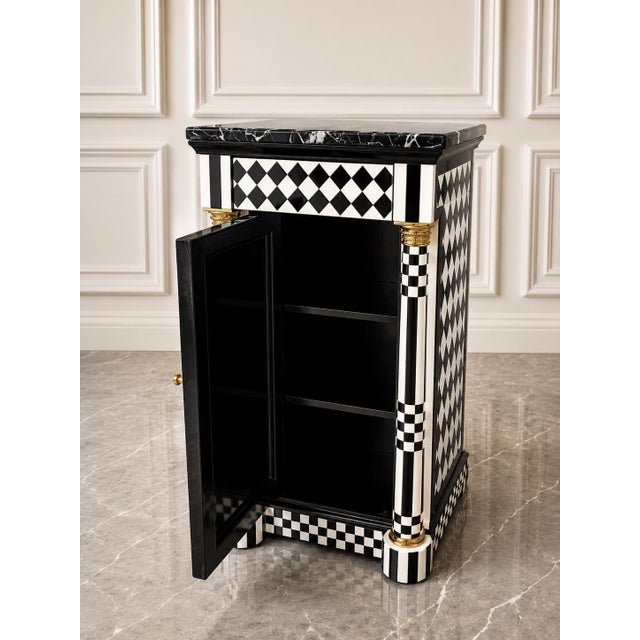 Add a bold designer statement to your interior with this stunning Harlequin Accent Cabinet, featuring the iconic black-...
