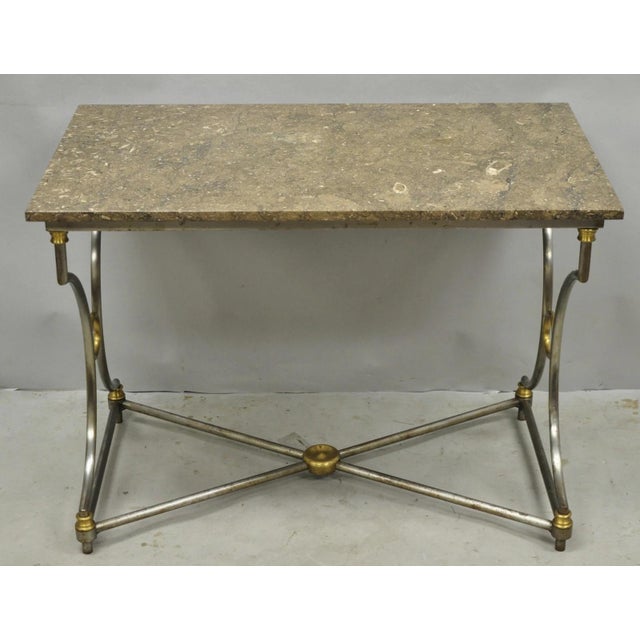 Vintage French Directoire Maison Jansen Style Steel & Brass Marble Top Console Table. Item features a brown specimen...