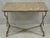 Vintage French Directoire Maison Jansen Style Steel & Brass Marble Top Console Table. Item features a brown specimen...