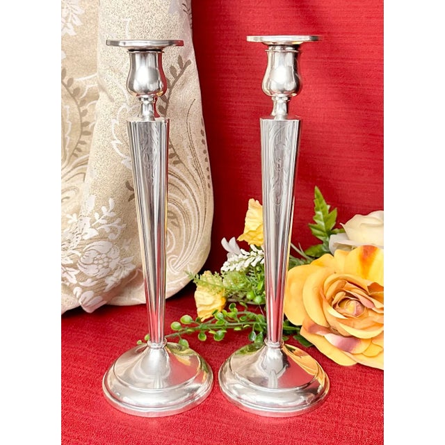 This is for a pair of Vintage Single Tall Candle holders. These are Sterling Silver and etched with a floral pattern and...