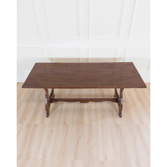 A striking 18th century Italian Fratino table, crafted in solid walnut and defined by the bold architectural lines and...