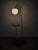 Rare and highly distinctive art deco floor lamp with an integrated side table, produced in czechoslovakia during the...