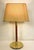 Very stylish Hansen Cognac-leather and brass tubular table lamp with round base. Designed by Hansen Lamps Inc. and...
