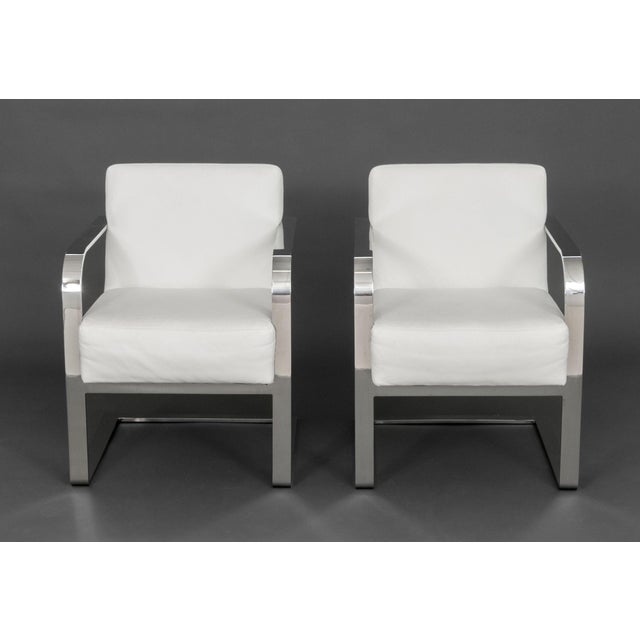 Pair of Ralph Lauren Home "Penthouse Collection" Club Chairs, each with white leather upholstery, chrome frame, and label...