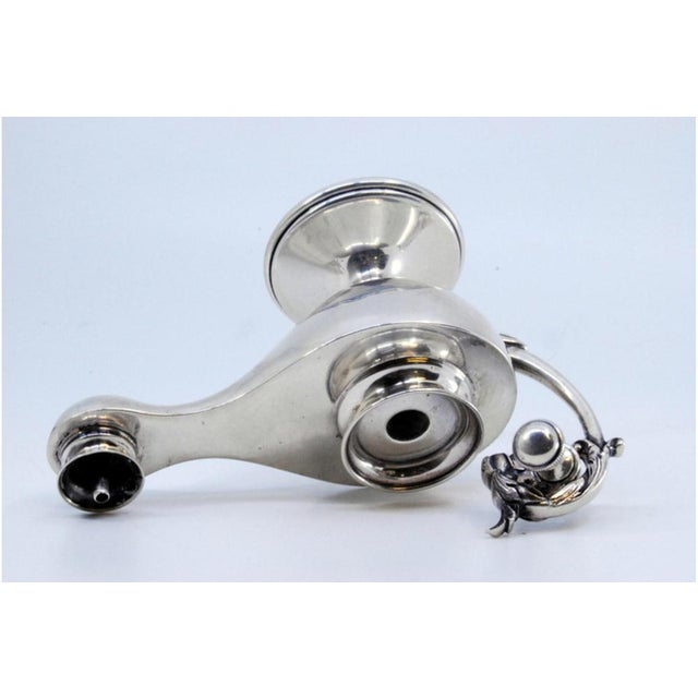 Silver Lamp with Embossed Animal Head Handle, in Very Good conditions. Designed 1920 to 1949 This piece has an attribution...