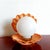 Coral-colored ceramic shell-shaped lamp with a white opaline glass globe replacing the pearl. Clean and functional wiring:...