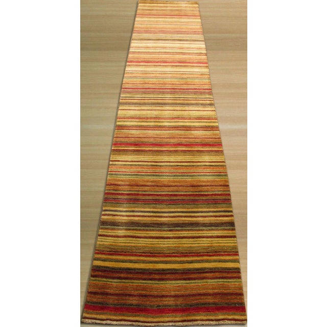 This multicolor jewel tone rug is crafted from wool using a durable flat weave technique. Designed in the traditional...