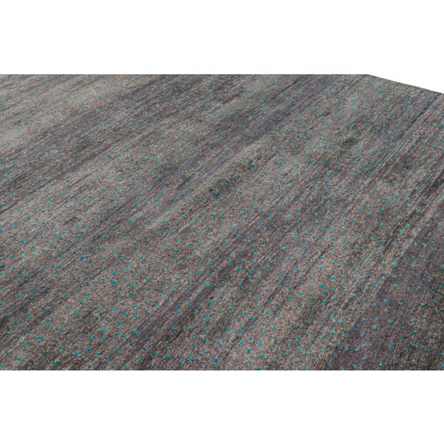 Hand-knotted in wool and silk, this 8x10 contemporary rug from Rug & Kilim features geometric patterns with a modern...