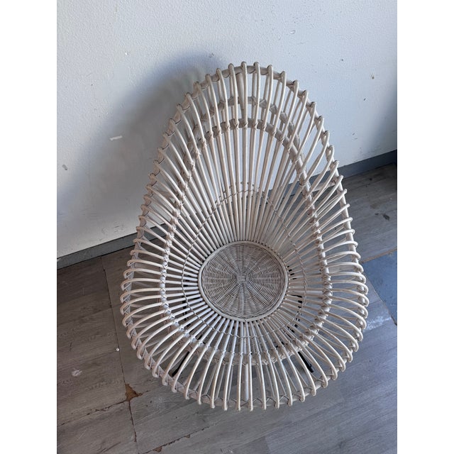 Iconic white painted rattan lounge chair designed by acclaimed designers Janine Abraham & Dirk Jan Rol. believed to be...