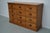 This apothecary bank of drawers was designed and made circa 1930. It was made from pine and it features 12 drawers with...