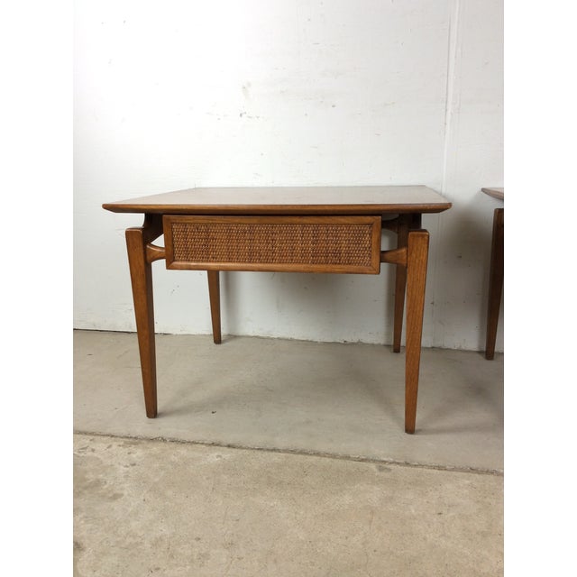 This pair of mid century modern end tables by Lane Furniture features hardwood construction, original walnut finish,...