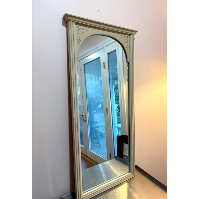 1950s Bassett cream/gold stenciled wood vertical wall mirror. Excellent condition. Measures 41" x 21.5" including frame.