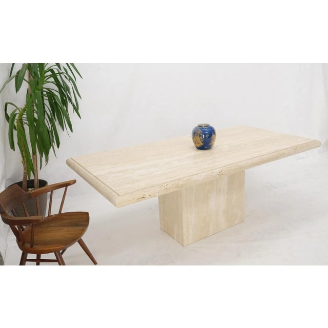 Large Italian travertine beveled edge single pedestal rectangle dining conference table.