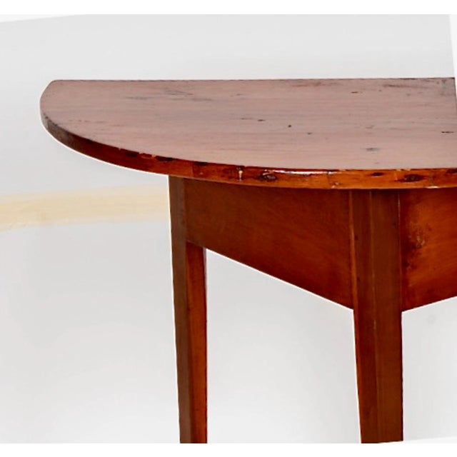 his is a charming mid-19th century pine demi-lune table that has been attributed to Shaker fabrication. The demi-lune...