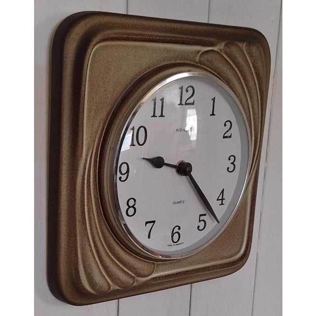 Vintage German Wall Clock with Beige-Brown Ceramic Case from Kienzle, 1970s, in Very Good conditions. Designed 1970 to...