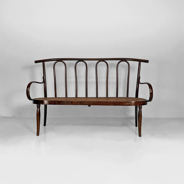 Italian wood and Vienna straw bench Thonet-style bench made of bentwood with a Vienna straw seat. The structure is...