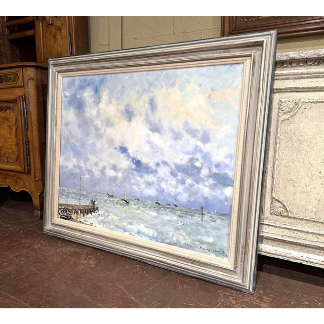 Capture the dramatic beauty of the Normandy coast with this luminous vintage marine painting by celebrated French artist...