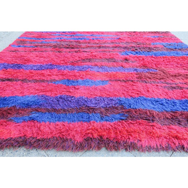 Highly individual hand woven long-piled rug dating from the 1960s, the design consisting of bold, long 'brush strokes' in...